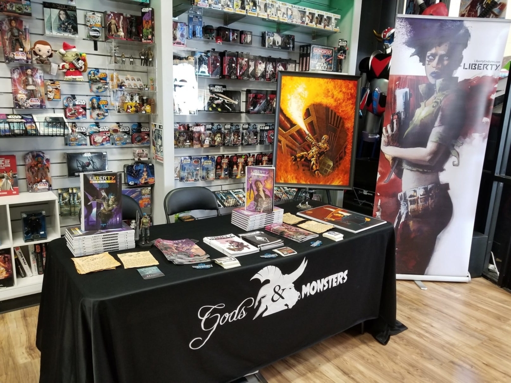 Travis Vengroff's booth setup to promote the Liberty podcast and tie-in book at a Comic Book Store Day event.
