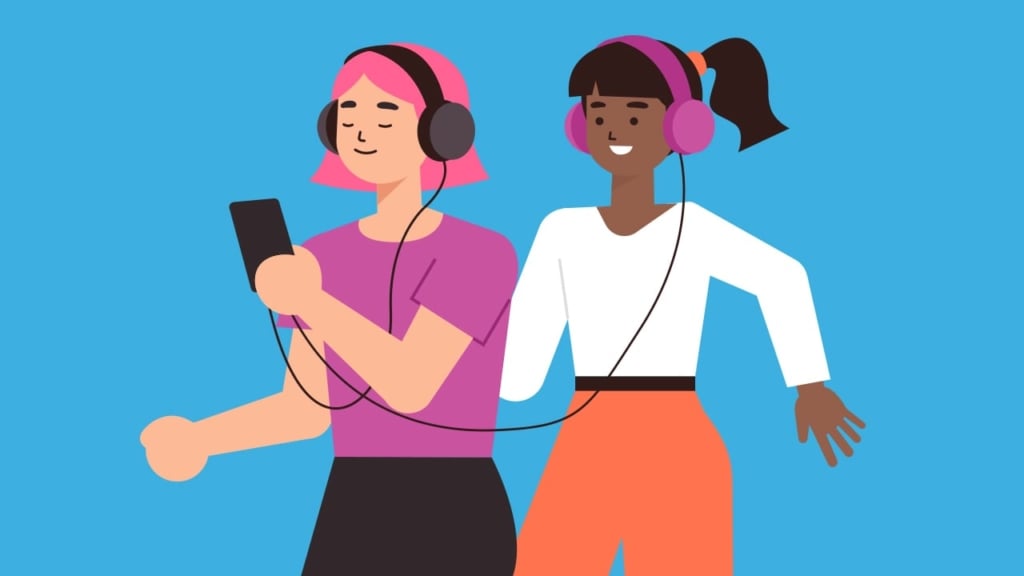 women listening to a podcast together