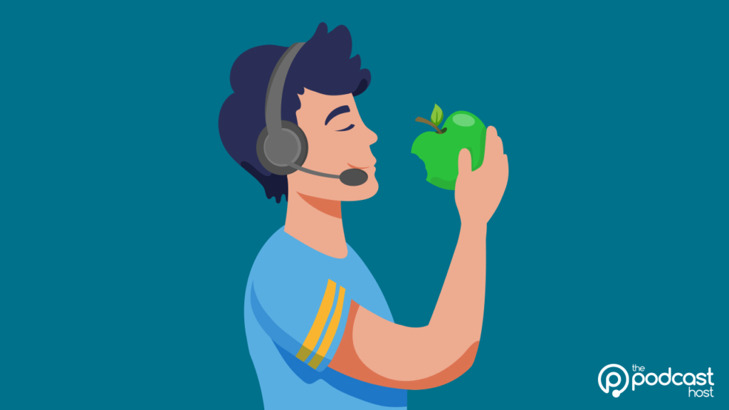 A podcaster wearing a headset and taking a bite of an Apple.